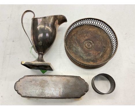Georgian silver helmet shaped cream jug, silver wine coaster, silver mounted brush and a silver napkin ringApprox. 4 ozs weig
