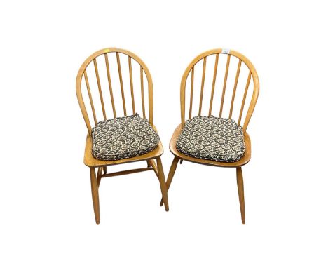 Two pairs of ercol dining chairs, together with another similar elbow chair (5)They appear to be in good condition, one defec