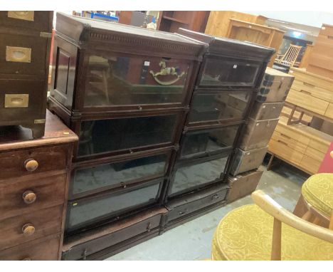 Edwardian Globe Wernicke mahogany four tier bookcase with dentil cornice, bevelled glazed doors flanked by fluted pilasters w