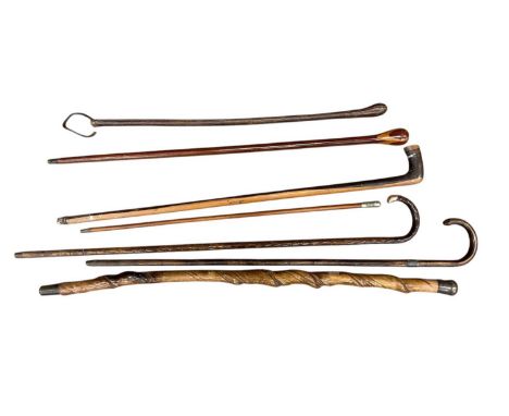 Group of walking sticks and canes, including a 12k gold mounted stick and a 'Pompadours' swagger stick
