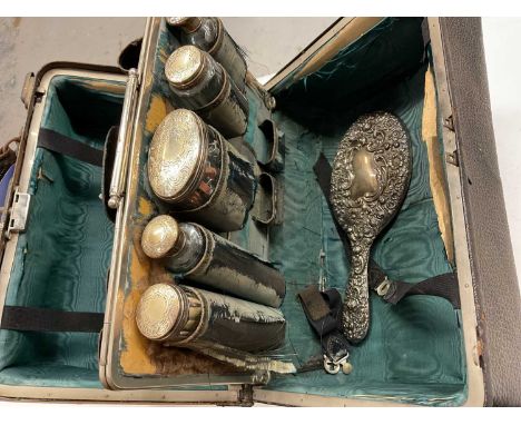 Vintage vanity case containing silver topped glass bottles, silver backed hand mirror, together with silver flatware includin