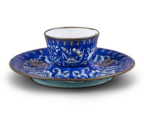 A FINE CANTON ENAMEL SORBET AND SAUCER CHINA, LATE QING DYNASTY, 19TH CENTURY The circular saucer with a central recessed par