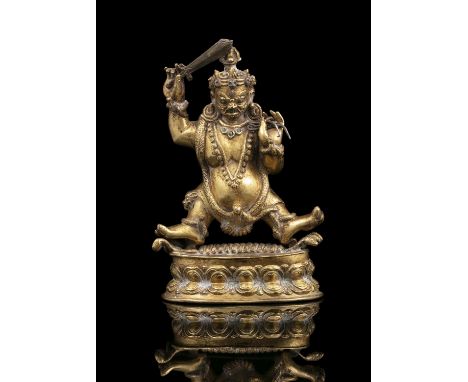 A STONE EMBELLISHED GILT COPPER ALLOY SCULPTURE OF A DEITY, POSSIBLY ACHALA OR VAJRAPANI  TIBET OR TIBETO-CHINESE / SINO-TIBE