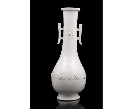 A LARGE DEHUA / BLANC DE CHINE PORCELAIN TWO-HANDLED PEAR-SHAPED VASE  CHINA, QING DYNASTY It rests on a tall spread foot and