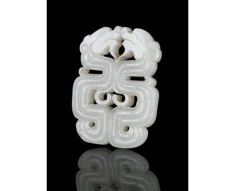 A RETICULATED JADE ‘KUI DRAGONS’ PLAQUE / PENDANT CHINA, LATE QING DYNASTY Finely carved and reticulated with two confronted 