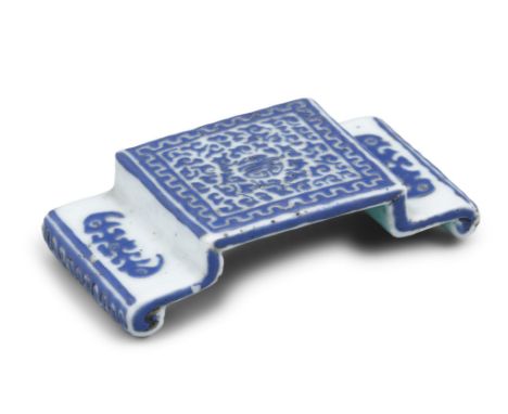 A RARE 'OVERLAY GLASS' IMITATION SCROLL-SHAPED PORCELAIN BRUSH REST  INSCRIBED WITH THE MARK OF EMPEROR QIANLONG CHINA, QING 