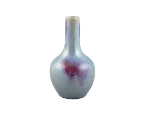 A FLAMBE / TRANSMUTATION GLAZED PORCELAIN BOTTLE VASE CHINA, QING DYNASTY It has a compressed globular body surmounted by a t