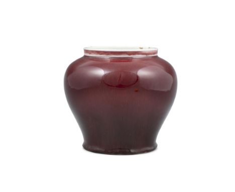 AN OXBLOOD / FLAMBE GLAZED BALUSTER PORCELAIN VASE CHINA, POSSIBLY LATE QING DYNASTY It rests on a short unglazed ring foot a