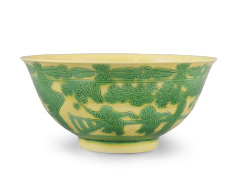 A GREEN AND YELLOW GLAZED INCISED PORCELAIN ‘BOYS’ BOWL CHINA, YONGZHENG MARK AND POSSIBLY OF THE PERIOD The deep rounded sid