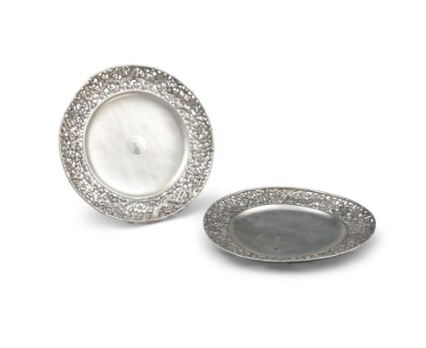 A PAIR OF CHINESE EXPORT SILVER ‘PLUM FLOWERS’ TRAYS OR DISHES BY C.J. &amp; CO CHINA, SHANGHAI, LATE QING DYNASTY, EARLY 20T