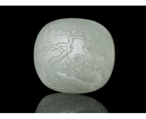 A CELADON JADE ‘PLUM AND BUTTERFLY’ ELEMENT OF A BELT BUCKLE  CHINA, QING DYNASTY L: 6 cm - width: 4,8 cm Weight: 44,5 grams 