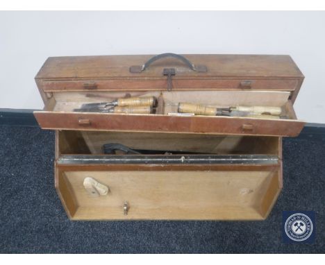 A mid 20th century joiner's tool box with hand tools
