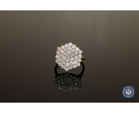 An 18ct gold diamond cluster ring, size M