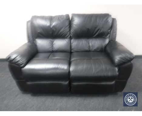 A black leather two-seater manual reclining settee