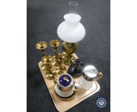 A tray of brass Duplex oil lamp, four graduated candlesticks, metal candle holder and a Victorian china teapot with water jug