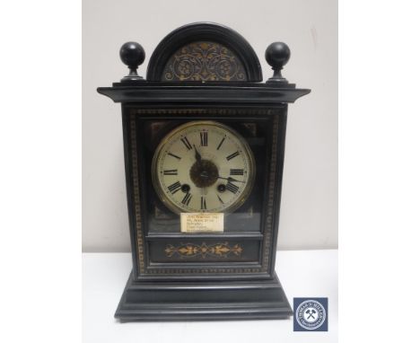 A late 19th century gilded ebonised bracket clock with brass and enamelled dial 