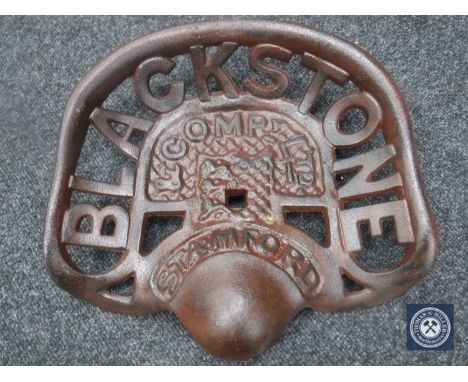 A cast metal "Blackstone" tractor seat 