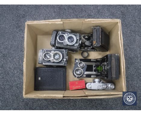 A box of two Rolleiflex folding cameras, Leica meter, Russian copy Leica camera etc 