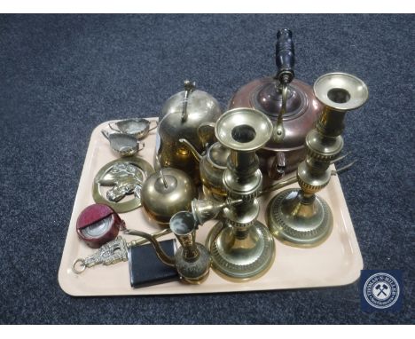 A tray of antique copper and brass kettle together with assorted brass ware including candlesticks, miniature teapot on stand