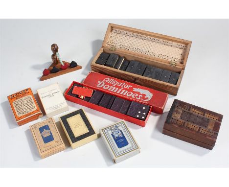 Two cribbage boards, together with packs of cards, dominoes sets and a bird, (qty)