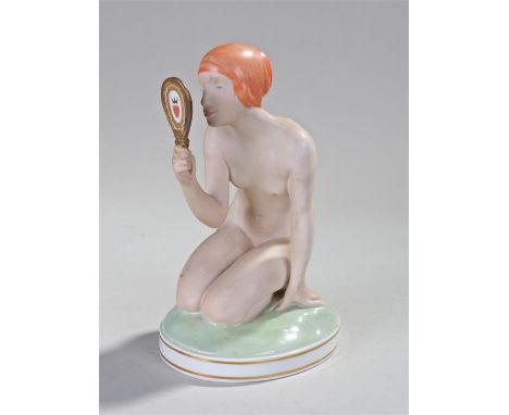 Royal Copenhagen porcelain figure, modelled by Gerhard Henning, a lady crouched looking into a mirror, crown mark to the base
