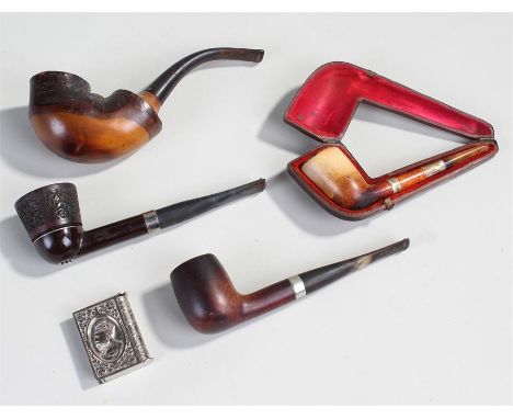 Four pipes, to include three wood examples and a meerschaum cased pipe, together with a vesta. (4)