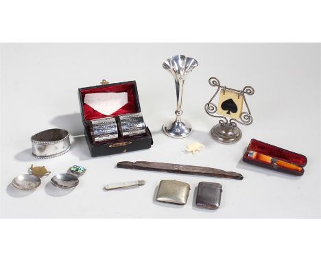 Mixed lot, to include a cigarette holder, a fruit knife, a trump marker, silver flower vase, a silver napkin ring, a silver c