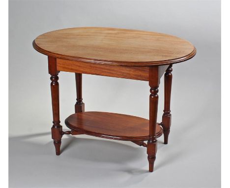 Victorian mahogany centre table, the oval top with turned legs united by a shelf, 94cm long x 60cm wide x 67cm high