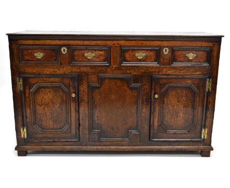 Late 18th-century dresser base, fitted two drawers with moulded decoration, lower section with fixed central panel flanked by