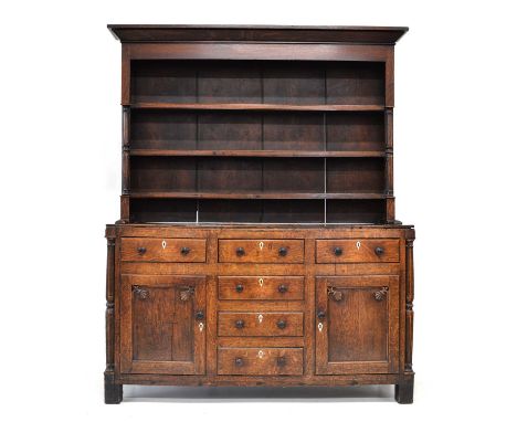 Early 19th century Carmarthenshire dresser, three shelf plate rack with applied split turned columns standing on base, fitted