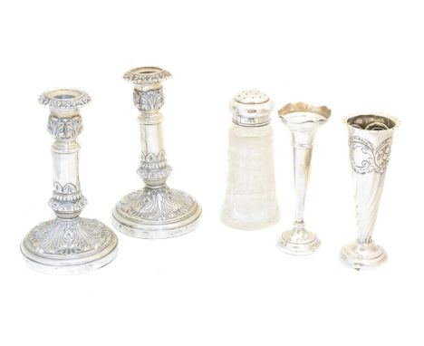 A selection of silver, to include a pair of George IV silver candlesticks, a silver vase and a clear glass silver topped shak