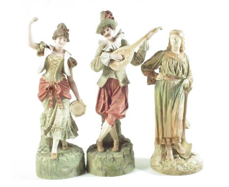 Pair of Robinson and Leadbeater figures and a Royal Worcester figures, the Parian figures modelled as musicians, late 19th ce