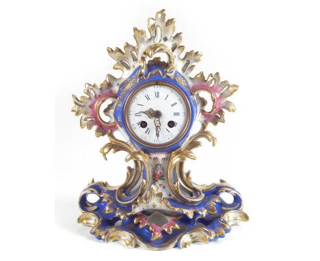 Paris porcelain clock, the body moulded with rococo scrolling and painted with flora, with key and pendulum, mid 19th century