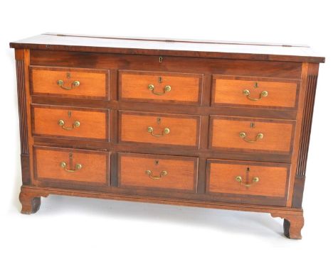 Early 19th-century oak and mahogany crossbanded Lancashire chest, rectangular top with hinged lid, above six false and three 