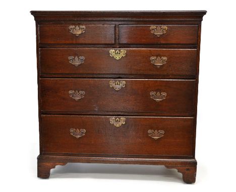 George III oak chest of two short and three long graduated drawers, rectangular two plank top, replacement brass bale and pla