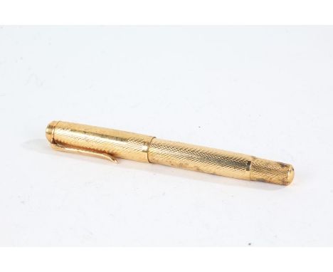 Pelikan gold plated fountain pen, with engine turned decoration, with 14ct gold nib