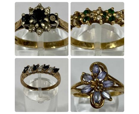 FOUR 9CT GOLD STONE SET RINGS comprising emerald and diamond chip band, size Q-R, floral blue stone set, size T, amethyst and