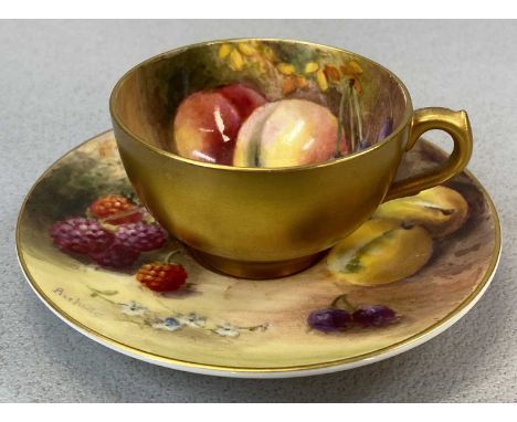 ROYAL WORCESTER MINIATURE CUP & SAUCER, painted with fruit and heavily gilded, signed Ricketts, puce marks, the saucer number
