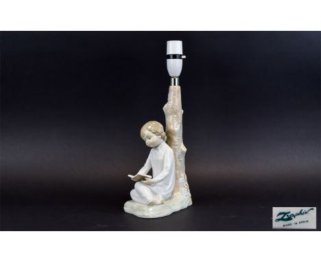 Lladro Lamp Base A charming lamp base in the form of a young girl in nightdress reading a book leaning against a tree. Good c