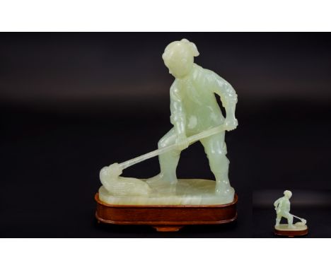 Chinese Impressive Mid 20thC Hand Carved Jade Figure of a Young Chinese girl with large mop. Raised on a rectangular shaped w