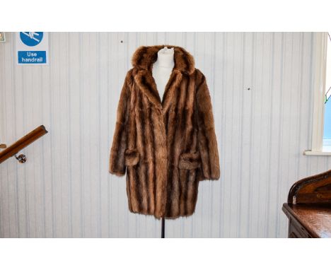 Vintage Mink Coat Mid length plush golden brown mink coat with front patch pockets, hook and eye closure and maroon polysatin
