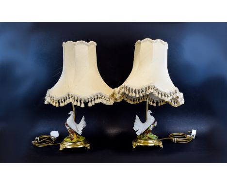 A Pair Of Decorative Capodimonte Gilt And Ceramic Lamps Each featuring ceramic doves on floral and foliate ceramic tree stump