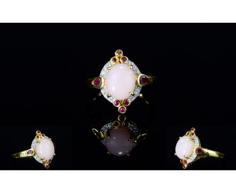 Pink Opal, Ruby and White Zircon Ring, a 2.75ct oval cut cabochon of natural pink opal, set in a lozenge shaped mount of 14ct