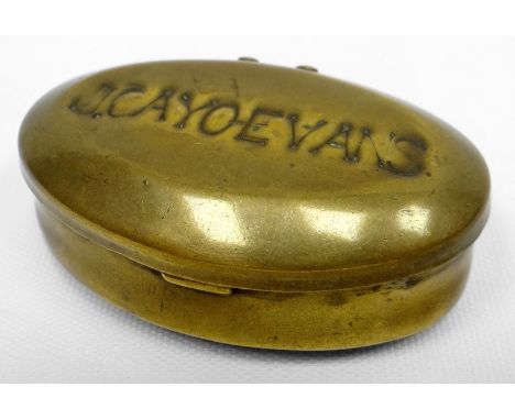 A brass oval snuff box with hinged lid impressed 'J CAYO EVANS', 2.75ins long (7cms), the name is that of William Edward Cayo
