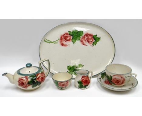 LLANELLY POTTERY - five piece cabaret-size tea-service, comprising oval tray, teapot, cream jug, cup and saucer and sugar bas