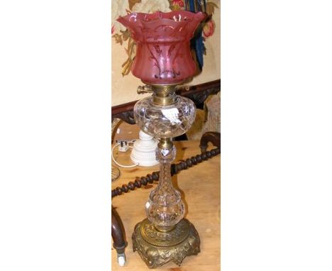 A good quality Victorian brass and cut glass oil lamp with cranberry shade - 70cm high CONDITION REPORTseems fine