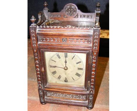 An oak cased mantel clock - 28cm high 