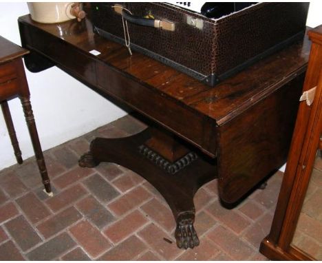 A 19th century rosewood sofa table with two drawers to the front and shaped base 