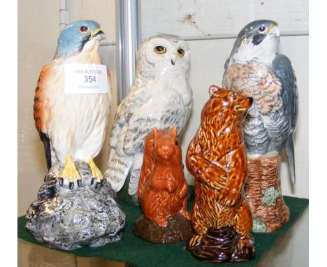 A Beswick Kestrel - Beneagles Scotch Whisky decanter (full), together with a Peregrine Falcon (full), Snowy Owl (full) and tw