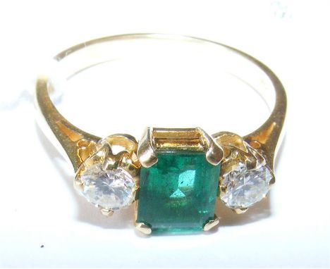 An emerald and two stone diamond ring in 18ct gold setting - size O